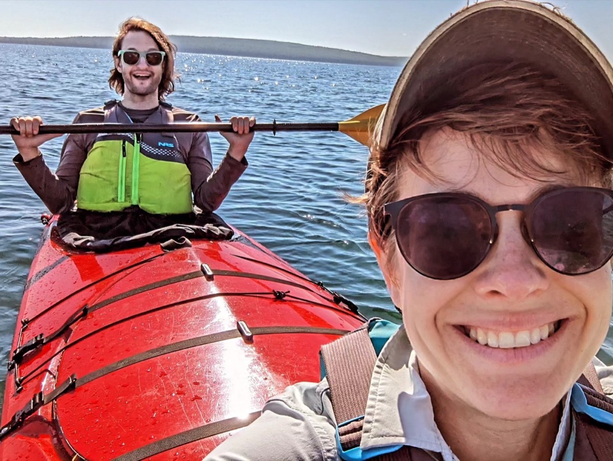A map comparing train travel times to Bayfield in 1900 with bus travel times in 2024, and photos of kayaking the Apostle Islands